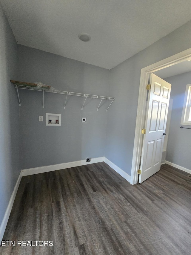 washroom with washer hookup, electric dryer hookup, wood finished floors, laundry area, and baseboards