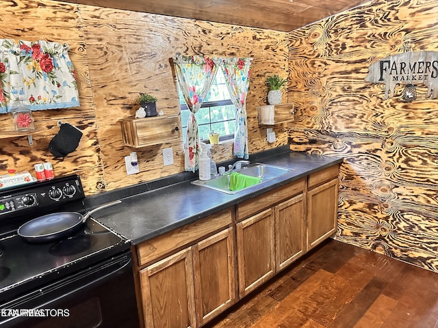 137 Summerset Ln, Pioneer, TN 37847 - kitchen with dark wood-style flooring, dark countertops, brown cabinetry, a sink, and black range with electric cooktop