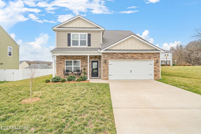 craftsman-style home with a garage, concrete driveway, fence, board and batten siding, and a front yard