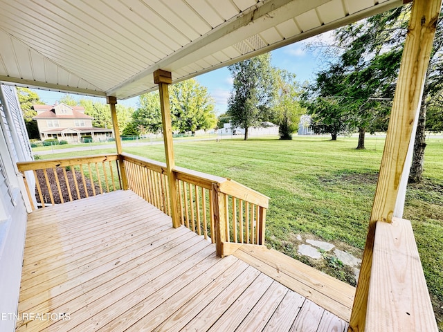 wooden deck with a lawn