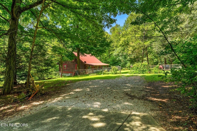 view of yard with a forest view