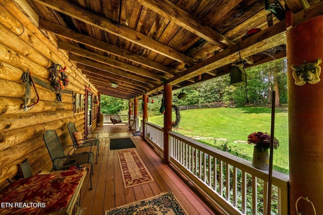 wooden deck with a lawn