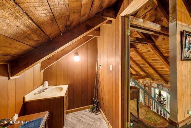 interior space with a sink and an upstairs landing