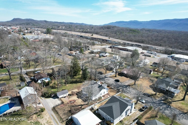 birds eye view of property with a residential view and a mountain view