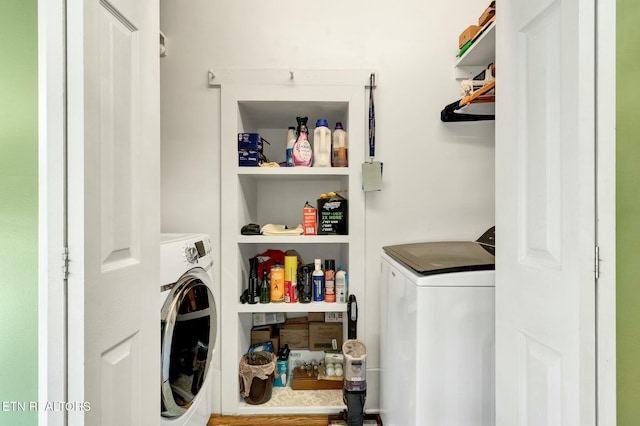 washroom featuring independent washer and dryer