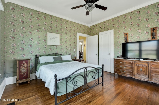 bedroom featuring ornamental molding, wood finished floors, a ceiling fan, and wallpapered walls