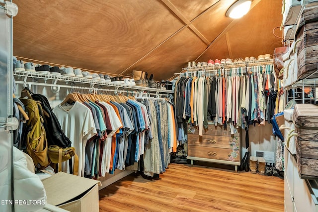 walk in closet featuring wood finished floors and visible vents