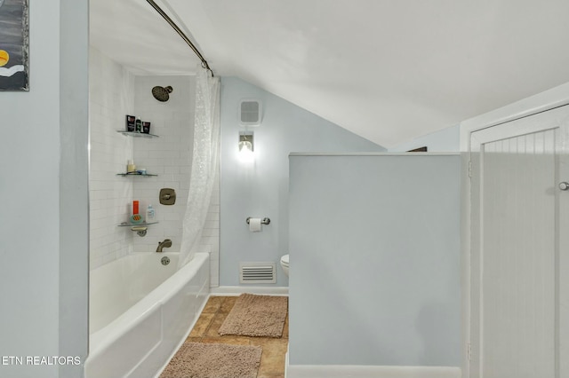 bathroom featuring lofted ceiling, toilet, visible vents, and shower / bathtub combination with curtain