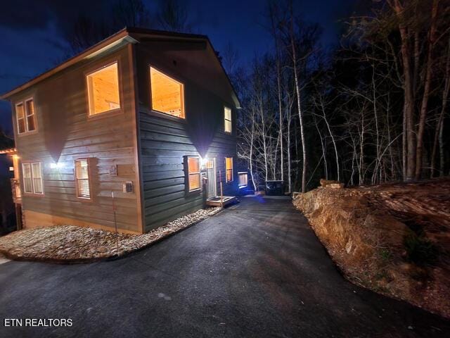 view of property exterior at night