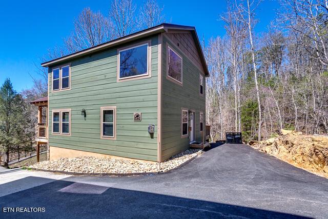 view of property exterior featuring driveway