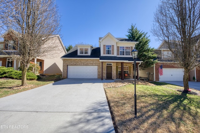 traditional home with concrete driveway, brick siding, a front lawn, and covered porch