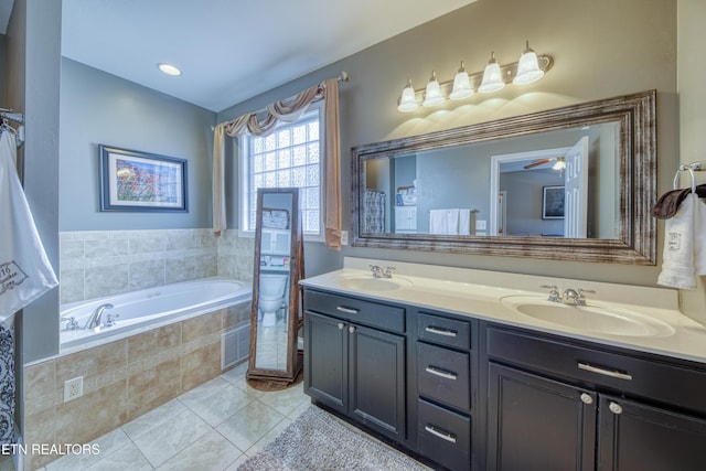 full bathroom with a bath, tile patterned flooring, double vanity, and a sink