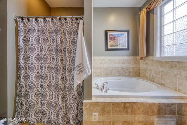 full bathroom featuring a bath, a shower with shower curtain, and visible vents