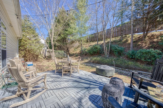 view of patio / terrace with outdoor dining space and fence