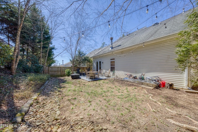 view of yard featuring a patio and fence