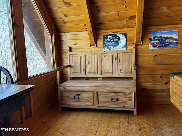 interior space featuring wood ceiling, wooden walls, and hardwood / wood-style floors