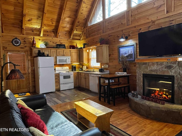 living room featuring dark wood-style floors, beam ceiling, wood walls, a stone fireplace, and wooden ceiling