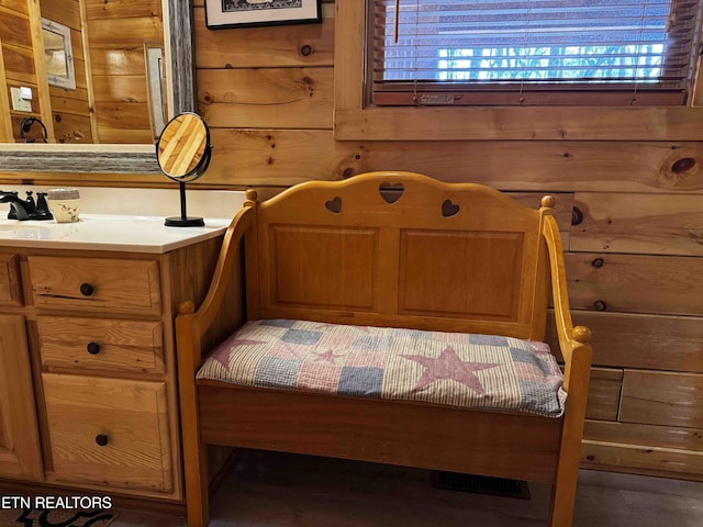 bedroom with wooden walls