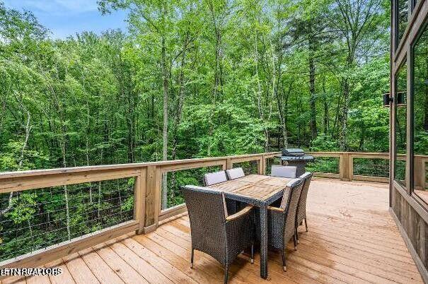 deck with outdoor dining area