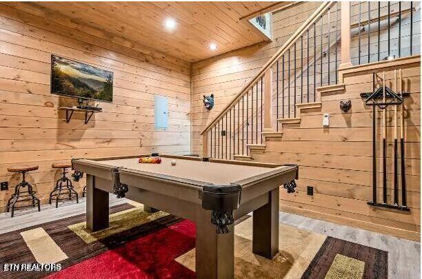 recreation room featuring pool table, wooden ceiling, wood finished floors, and wooden walls