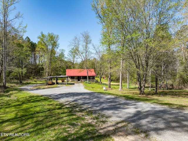 346 Chestuee Rd, Calhoun, TN 37309 - view of community featuring a yard, driveway, and a view of trees