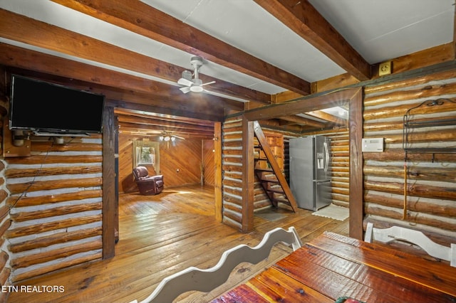 346 Chestuee Rd, Calhoun, TN 37309 - living area featuring beamed ceiling, wood-type flooring, a ceiling fan, and stairway