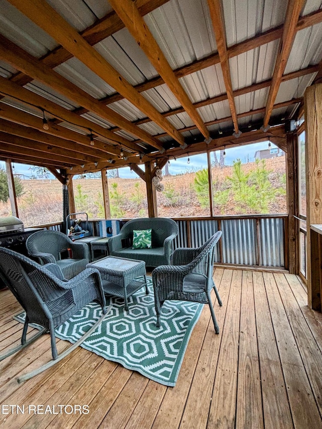 wooden deck with an outdoor living space