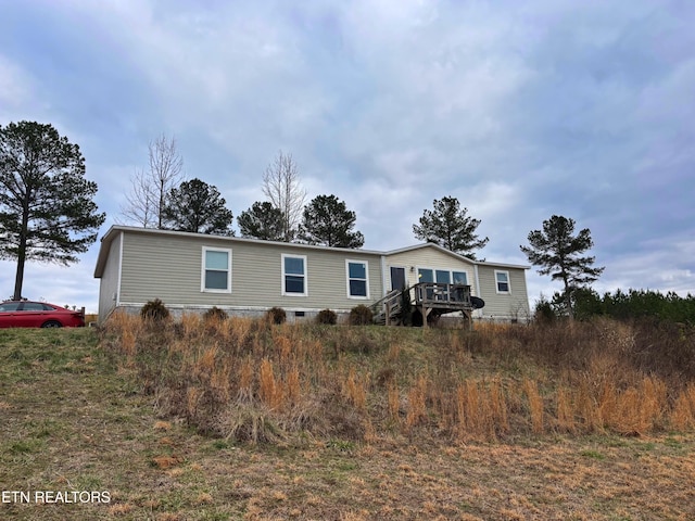 manufactured / mobile home featuring a deck and crawl space