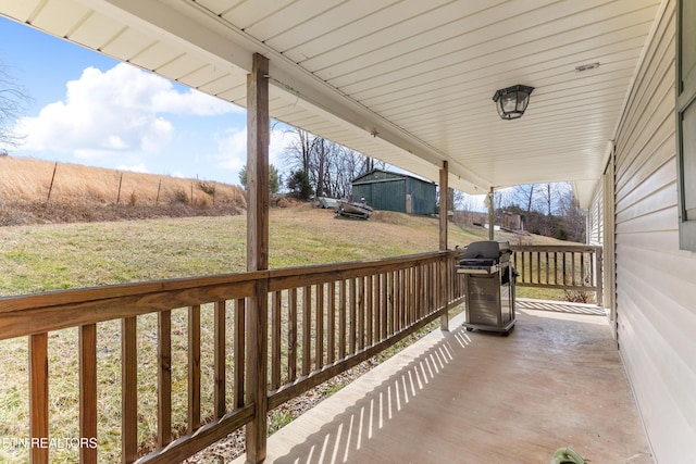 view of patio featuring an outbuilding and grilling area