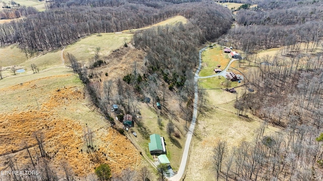 birds eye view of property with a wooded view