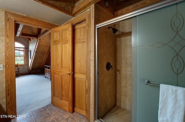 full bath featuring a shower stall and tile patterned floors