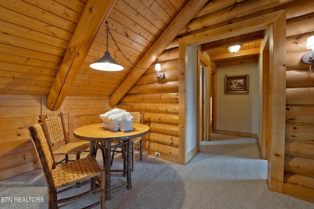 carpeted dining room with log walls, wooden ceiling, beam ceiling, and baseboards