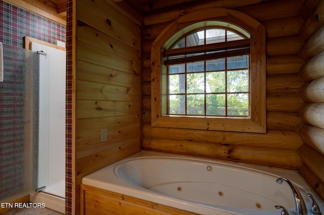 full bathroom featuring a tub with jets