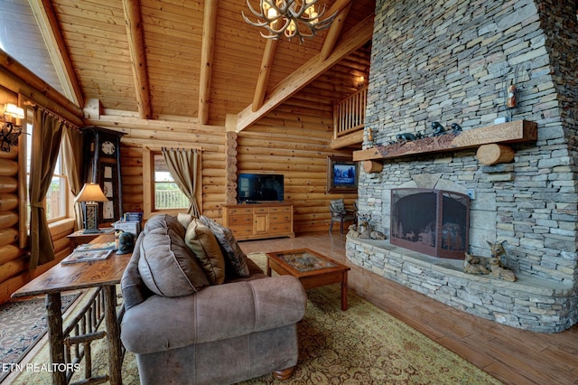 living room featuring beam ceiling, wood ceiling, a stone fireplace, wood finished floors, and high vaulted ceiling