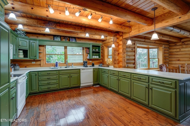 kitchen featuring a peninsula, white appliances, a sink, open shelves, and green cabinetry