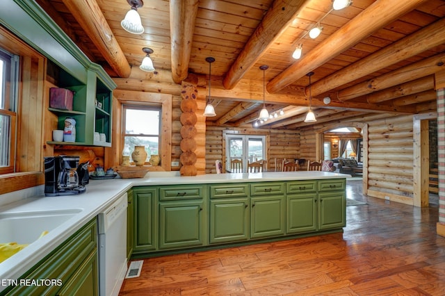 kitchen featuring visible vents, dishwasher, light wood-style flooring, green cabinets, and beam ceiling