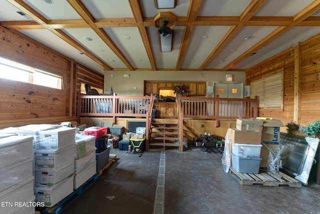 miscellaneous room featuring visible vents and wooden walls