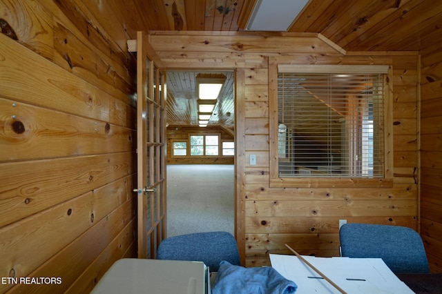 interior space with wooden ceiling and wooden walls