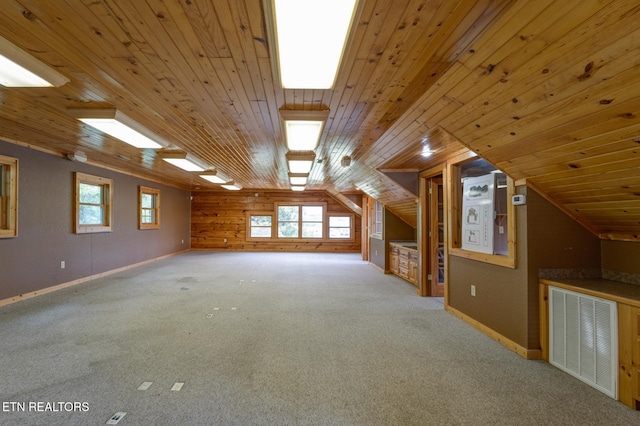 bonus room featuring vaulted ceiling, a wealth of natural light, wood ceiling, and visible vents