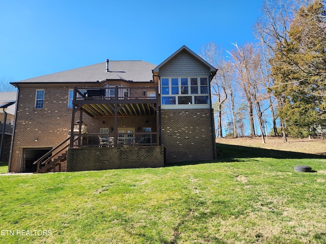 back of property with brick siding, stairway, a wooden deck, and a yard