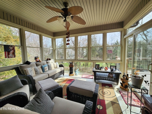 sunroom with wooden ceiling and ceiling fan