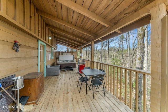 wooden deck with a grill and a hot tub