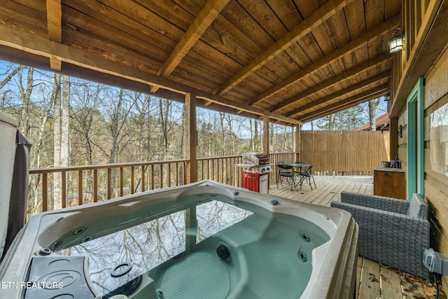 sunroom / solarium featuring wood ceiling, a hot tub, and lofted ceiling with beams