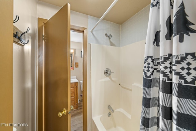 bathroom with shower / bath combination with curtain and vanity