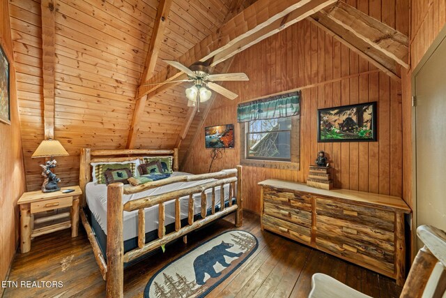 bedroom with vaulted ceiling with beams, wood walls, and hardwood / wood-style flooring