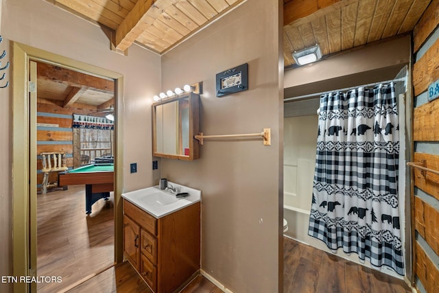 full bathroom with vanity, beamed ceiling, wood finished floors, and wood ceiling