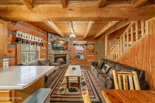 unfurnished living room with wood walls, a fireplace, wood ceiling, beamed ceiling, and dark wood finished floors