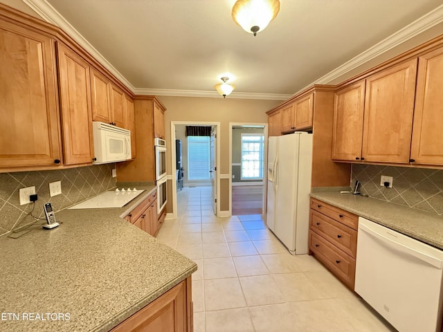 kitchen featuring white appliances, light tile patterned floors, brown cabinetry, ornamental molding, and backsplash