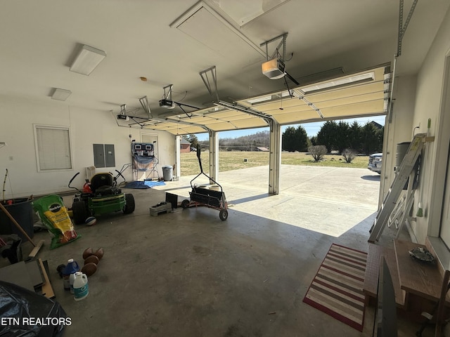 garage featuring a garage door opener and electric panel