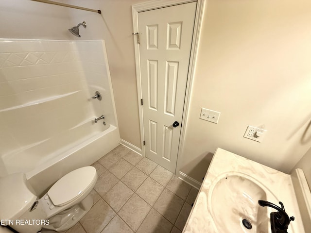 bathroom with tile patterned flooring, toilet, vanity, baseboards, and shower / washtub combination